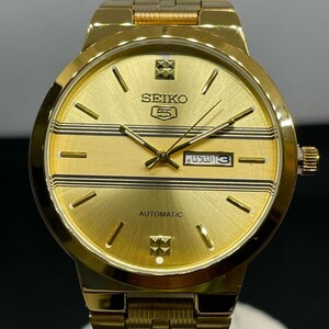 ساعة SEIKO أوتوماتيك ذهبي و ميناء اسود مخطط ابيض