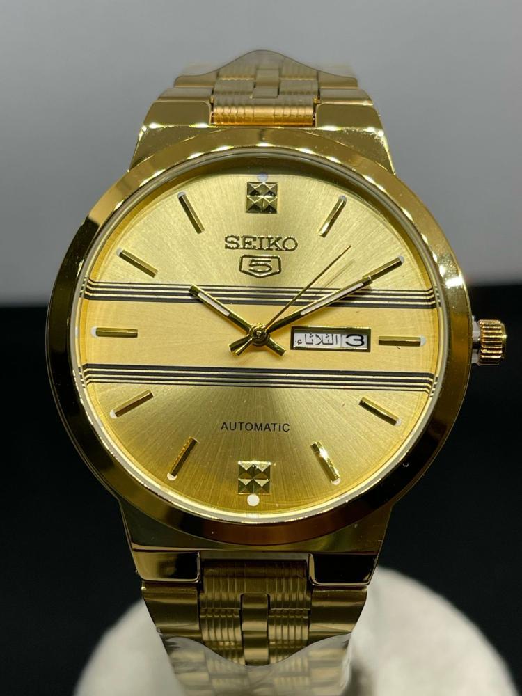 ساعة SEIKO أوتوماتيك ذهبي و ميناء اسود مخطط ابيض