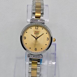 ساعة نسائية ميناء دائري ذهبي و سوار رصاصي مخطط ذهبي